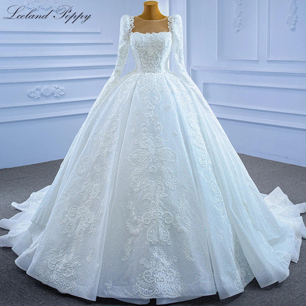 Robe de mariée perlée manches longues – CLEVI Paris