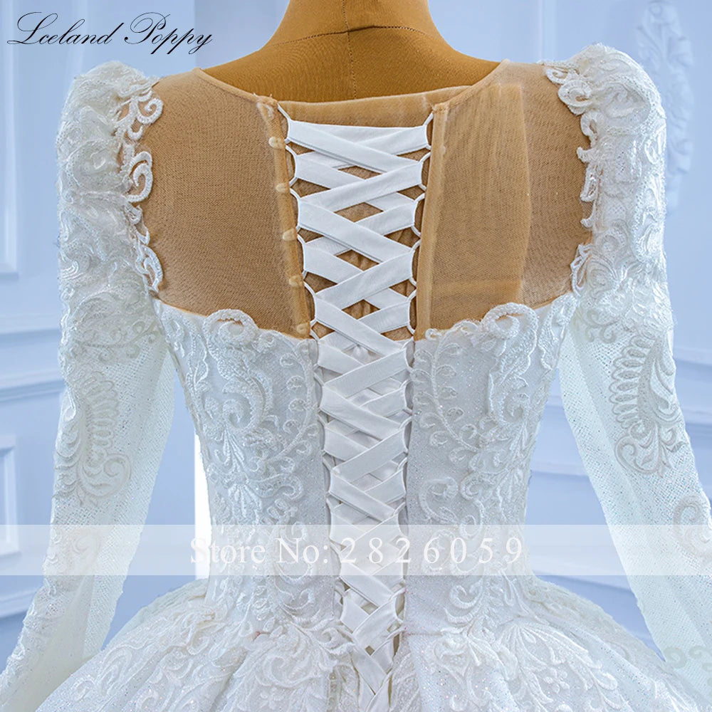 Robe de mariée perlée manches longues – CLEVI Paris