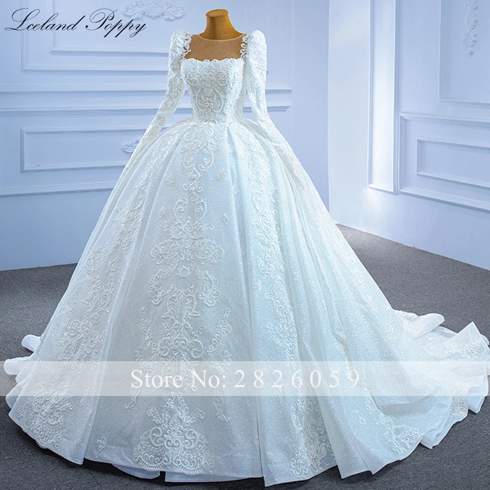 Robe de mariée perlée manches longues – CLEVI Paris