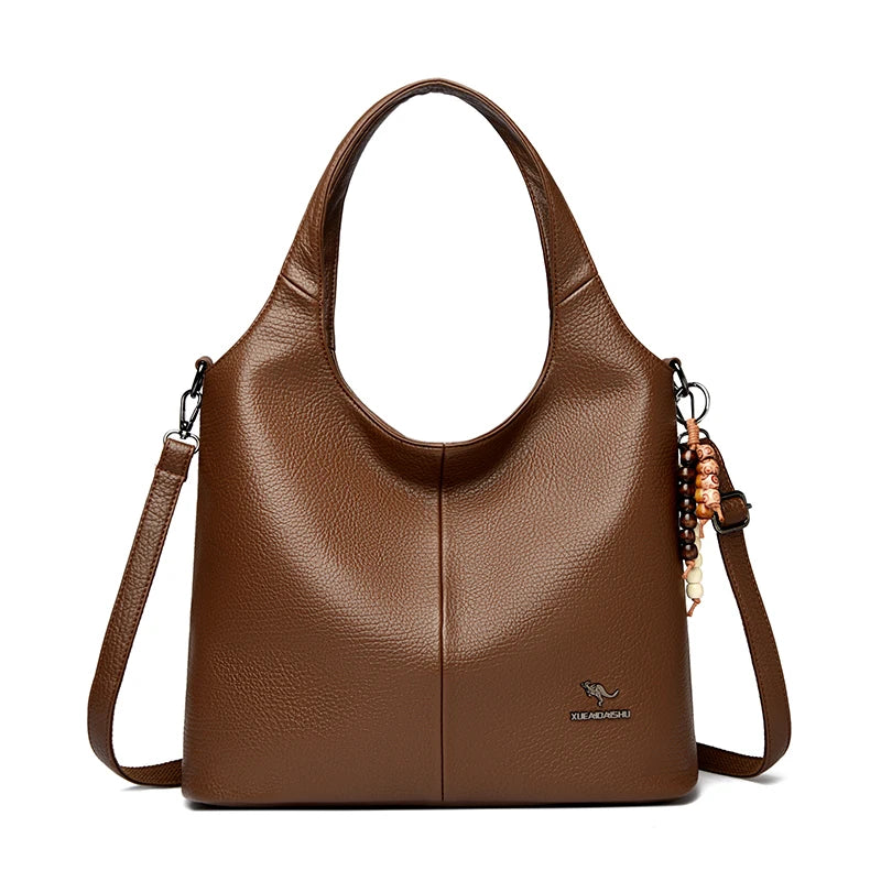 Sac seau femme souple à pompon – CLEVI Paris