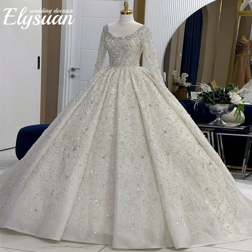 Robe de mariée princesse en tulle à manches longues – CLEVI Paris