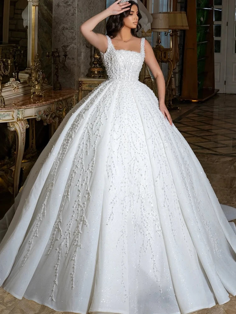 Robe de mariée princesse en organza perlé – CLEVI Paris