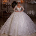 Robe de mariée en tulle col V manches longues – CLEVI Paris