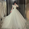 Robe de mariée bohème plissée à col haut – CLEVI Paris