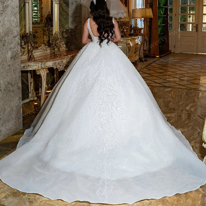Robe de mariée princesse en organza perlé – CLEVI Paris
