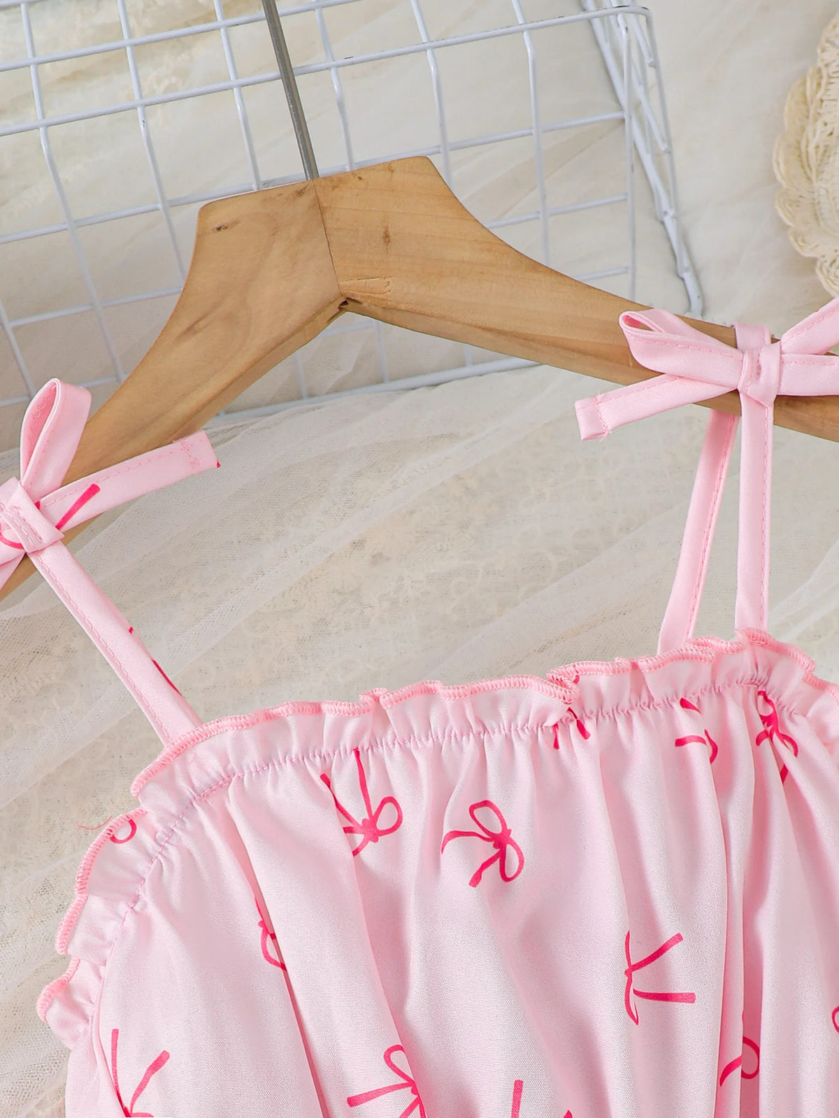 Robe fille rose à motif nœud papillon – CLEVI Paris
