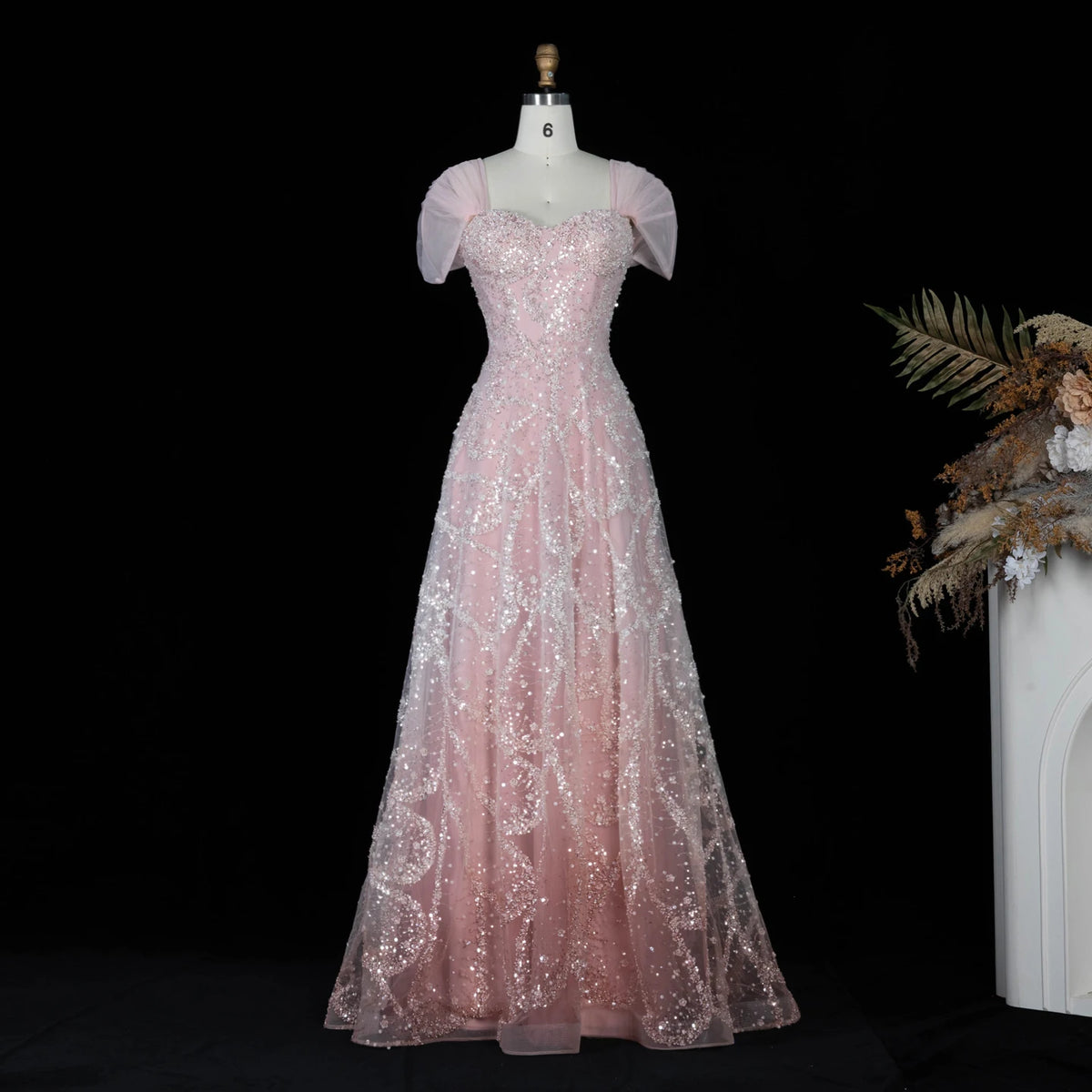 Robe de soirée trapèze perlée et croisée – CLEVI Paris