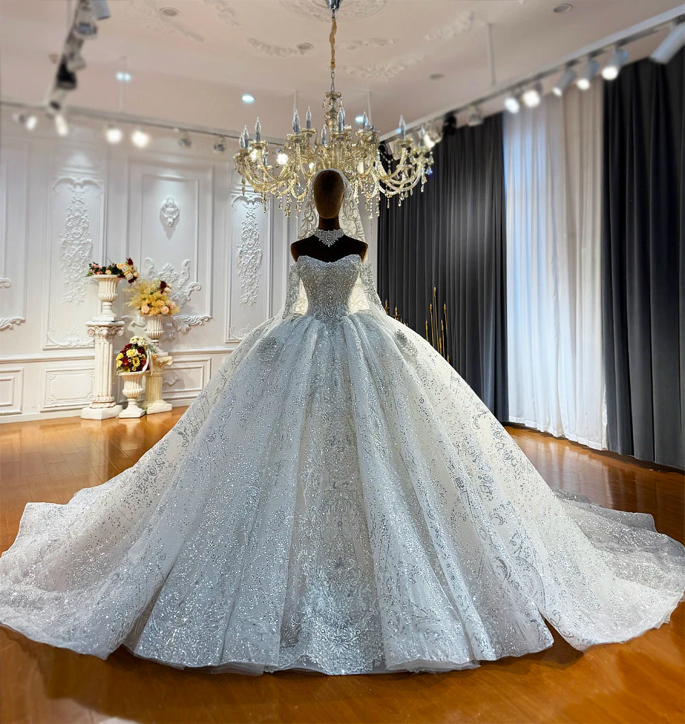 Robe de mariée en tulle à manches longues – CLEVI Paris