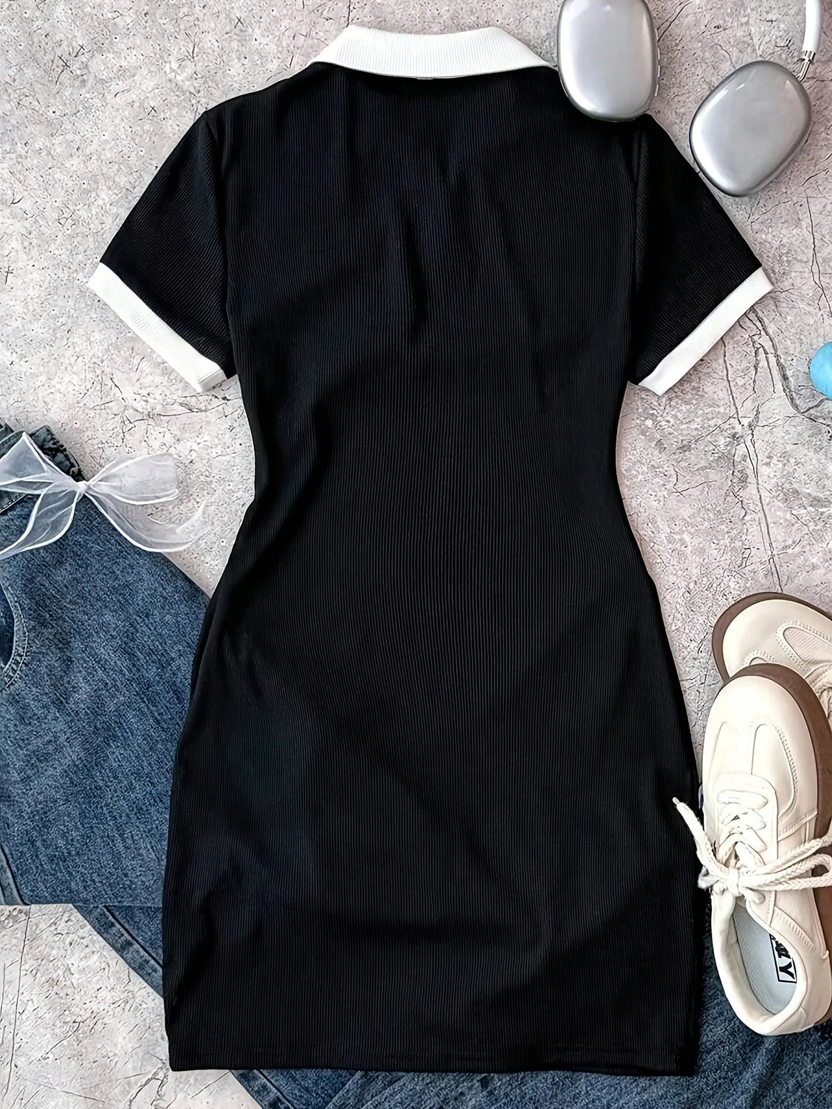 Robe polo fille en noire à motif nœud – CLEVI Paris